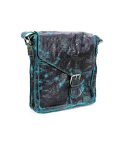 A vintage-inspired masterpiece, the Venice Beach shoulder bag by Bed Stu boasts a weathered leather design with a dark blue and black marbled pattern and a front flap secured by a buckle. This handmade crossbody bag promises both style and durability.