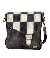 Black and white checkered leather messenger bag with a Bed Stu Venice Beach II front panel closure and adjustable shoulder strap, isolated on a white background.