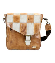 A Bed Stu Venice Beach II leather messenger bag with a checkered front panel, featuring an adjustable strap and a front buckle closure.