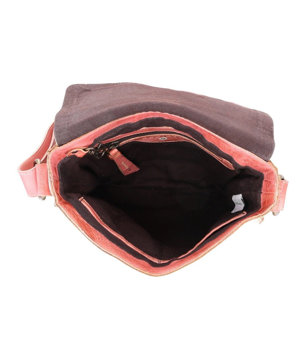 The inside of a Venice Beach pink and white crossbody bag by Bed Stu.