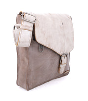 A Venice Beach vegetable tanned leather messenger bag with an adjustable strap, made by Bed Stu.