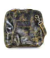 The Ventura by Bed Stu is a worn, distressed leather messenger bag featuring zippered pockets, a zipper closure, and an adjustable strap. This leather gem can be worn as a cross-body for effortless style and convenience.