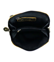 An open Ventura handbag by Bed Stu, featuring black and brown leather with zippered pockets and multiple compartments visible inside.