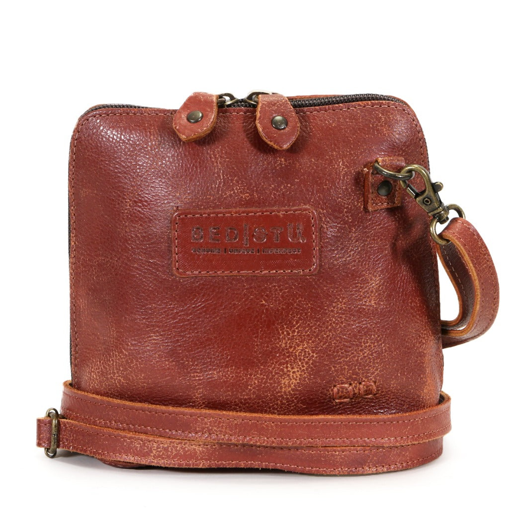 A brown leather Ventura cross body bag with a strap, by Bed Stu.