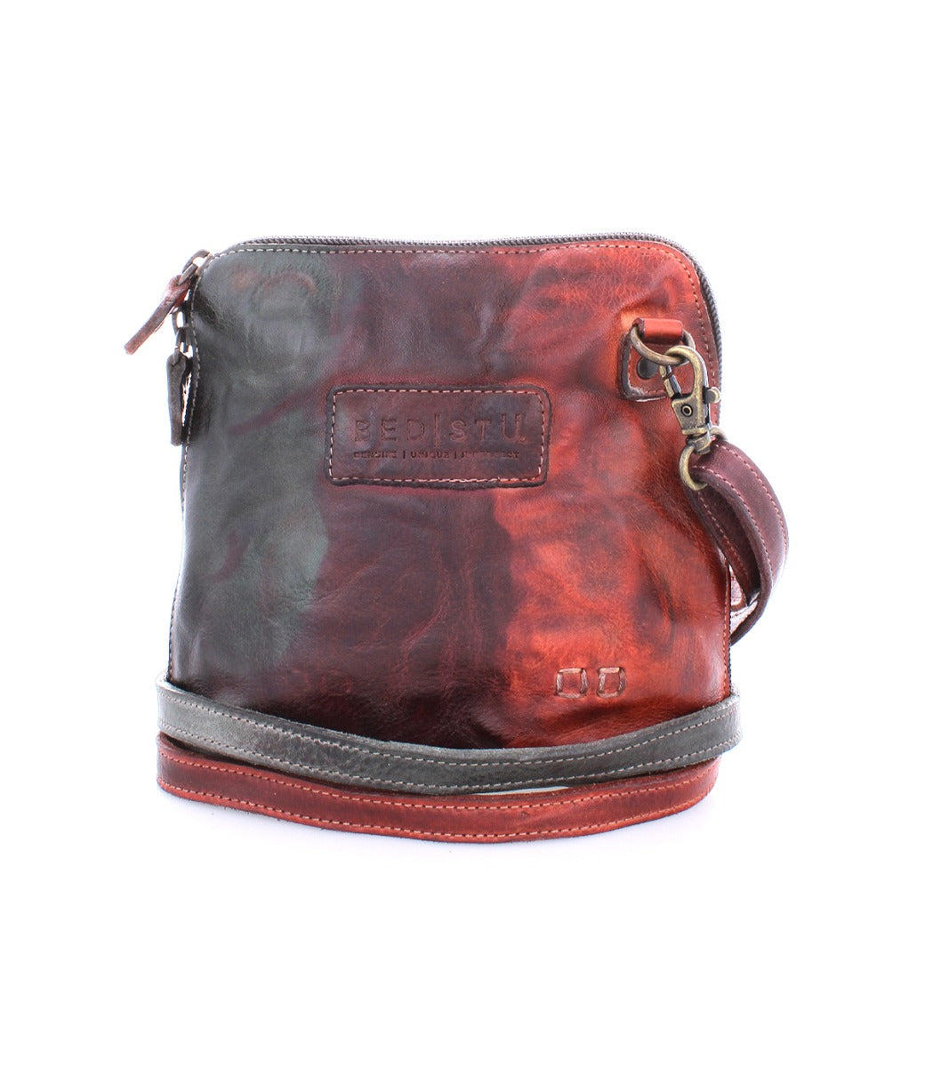 A red and black Ventura cross body bag with a zipper by Bed Stu.