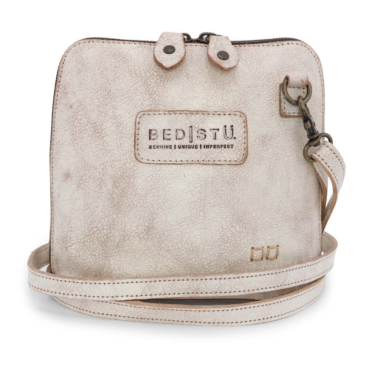 A white Ventura cross body bag with a strap, made by Bed Stu.
