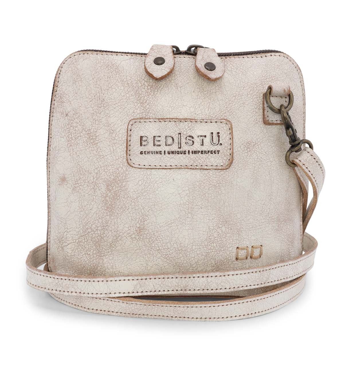 A white Ventura cross body bag with a strap, made by Bed Stu.
