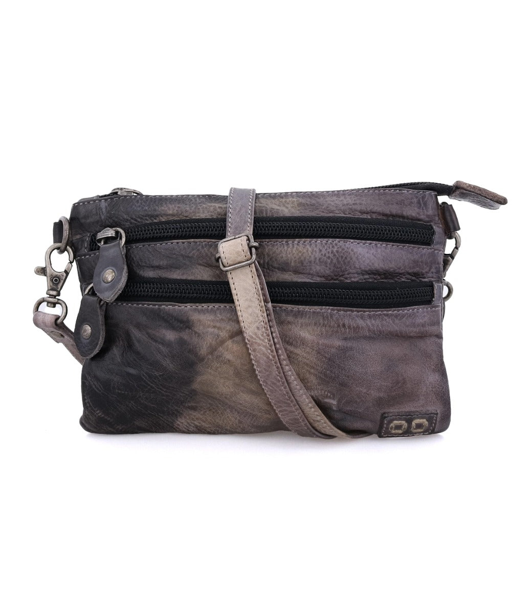 A Bed Stu Viana grey leather crossbody bag with a zipper.