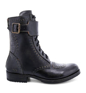 Black leather moto-inspired Walker boot with a buckle, lace-up front, and detailed stitching, isolated on a white background by Bed Stu.