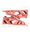 A pair of Wonder pink sandals with white straps by Bed Stu.