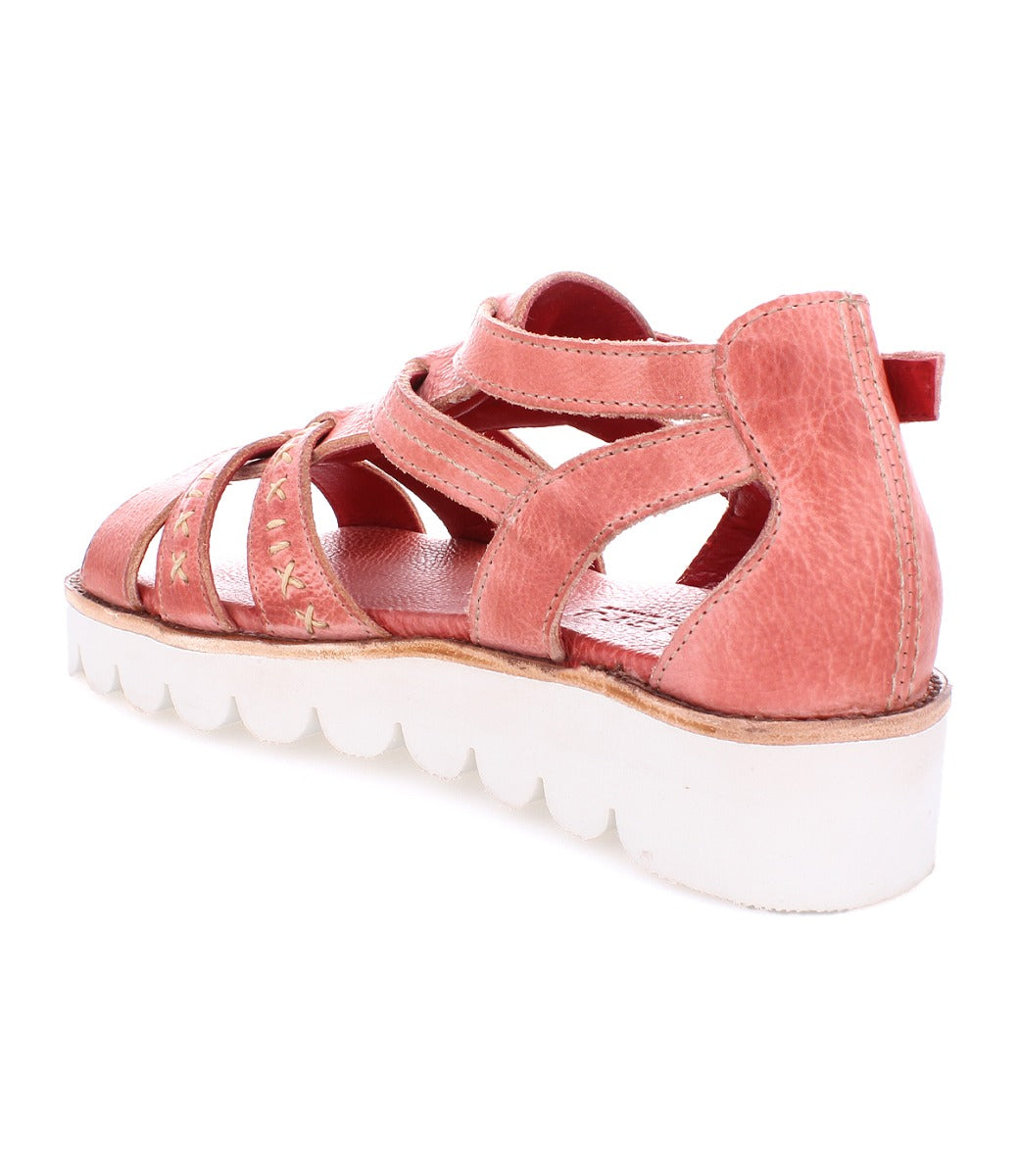 A women's pink sandal with straps and a white sole, called Wonder by Bed Stu.