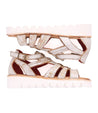 A pair of Bed Stu white sandals with straps and studs, called Wonder.
