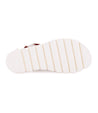 A pair of Wonder sandals from Bed Stu with a red sole.