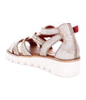 A women's Wonder sandal with straps and a white sole from the brand Bed Stu.