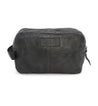 A Yatra by Bed Stu black leather toiletry bag on a white background.