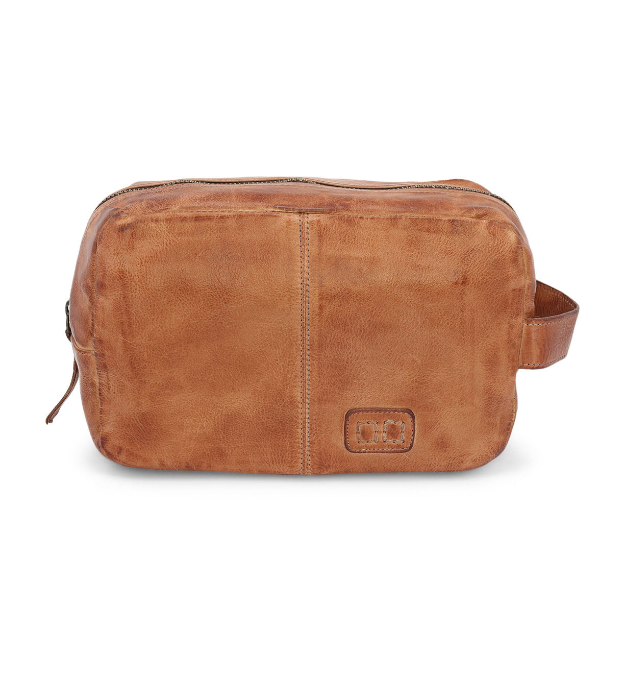 A Yatra by Bed Stu tan leather toiletry bag on a white background.