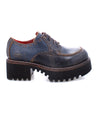 A pair of blue Bed Stu Yazar oxford shoes with black soles.