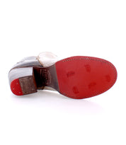 A pair of durable leather Yell boots with red soles against a white background. (Brand: Bed Stu)