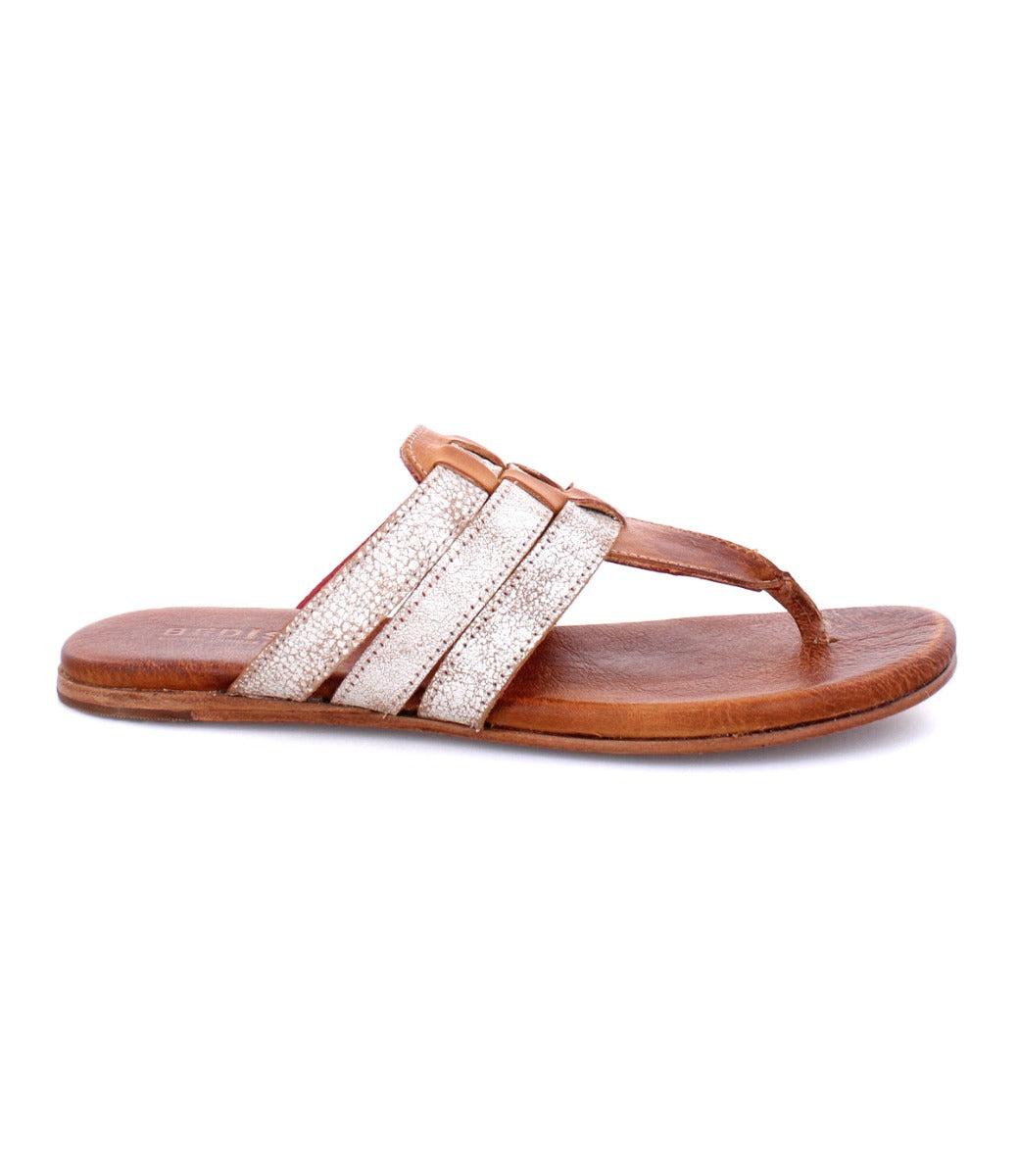 A pair of Bed Stu Yoli women's sandals with white and tan leather.