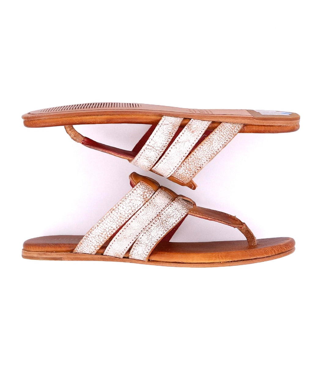 A pair of Bed Stu Yoli women's sandals with white straps.
