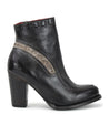 A black leather Yuno ankle boot for women with metal detailing by Bed Stu.