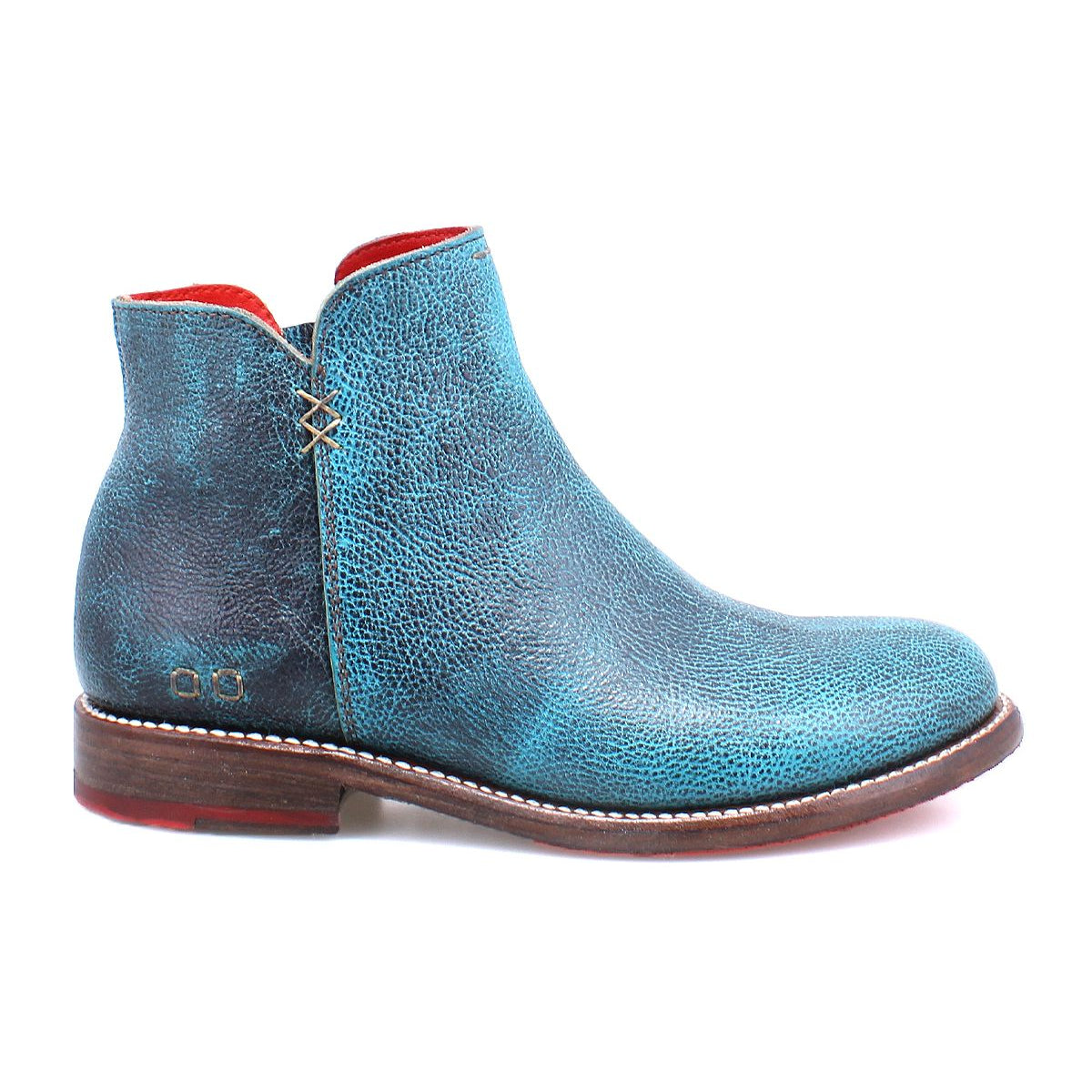 A side view of the Bed Stu Yurisa blue leather ankle boot, featuring a red interior lining, brown sole, and white stitching, showcasing a timeless design.