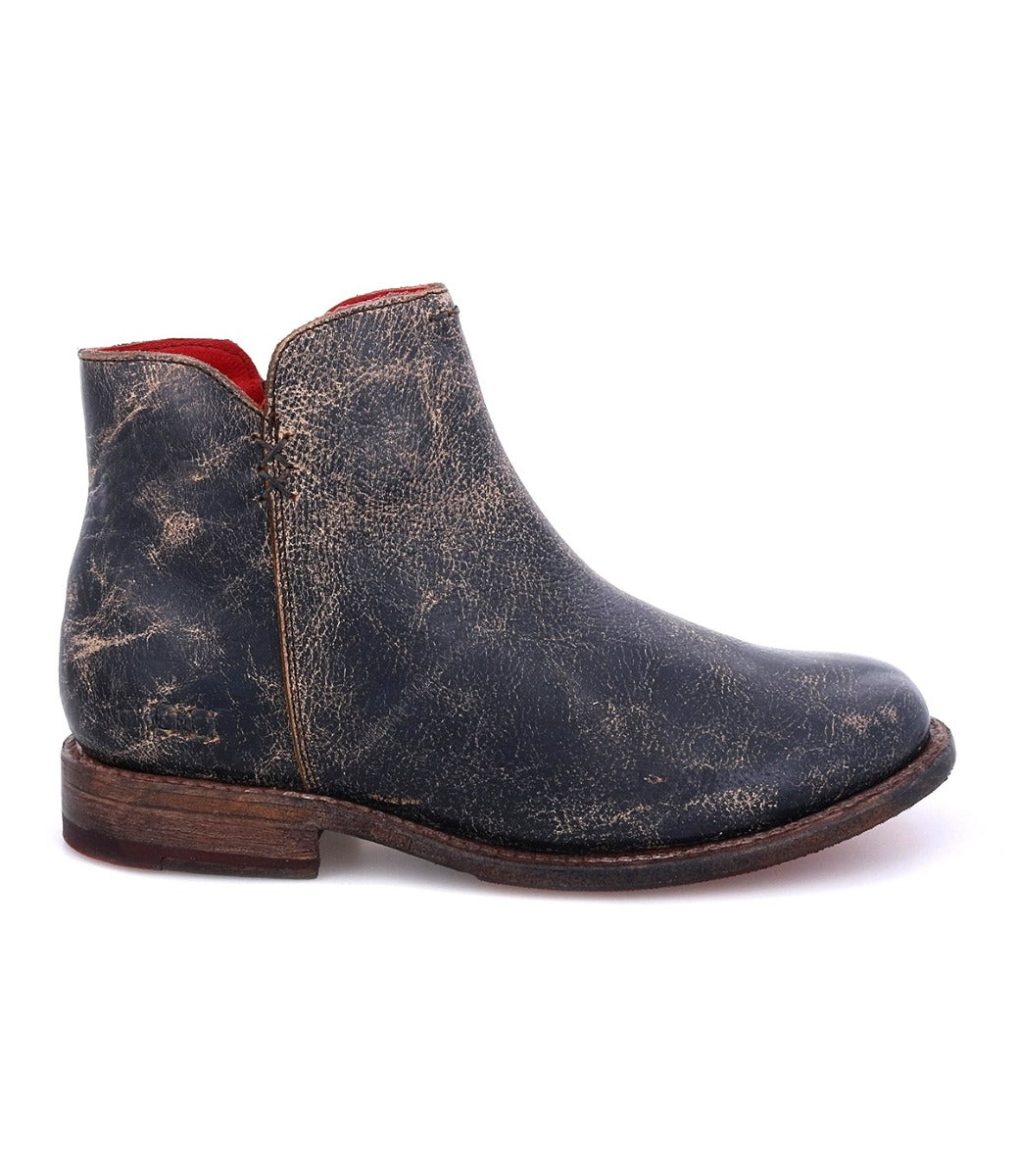 A women's Yurisa black leather ankle boot with a red sole from Bed Stu.