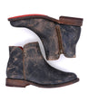 A pair of Yurisa black leather ankle boots with red soles by Bed Stu.