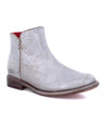 A Yurisa silver leather ankle boot with a red sole by Bed Stu.