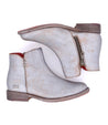 A pair of Yurisa women's silver leather ankle boots by Bed Stu.
