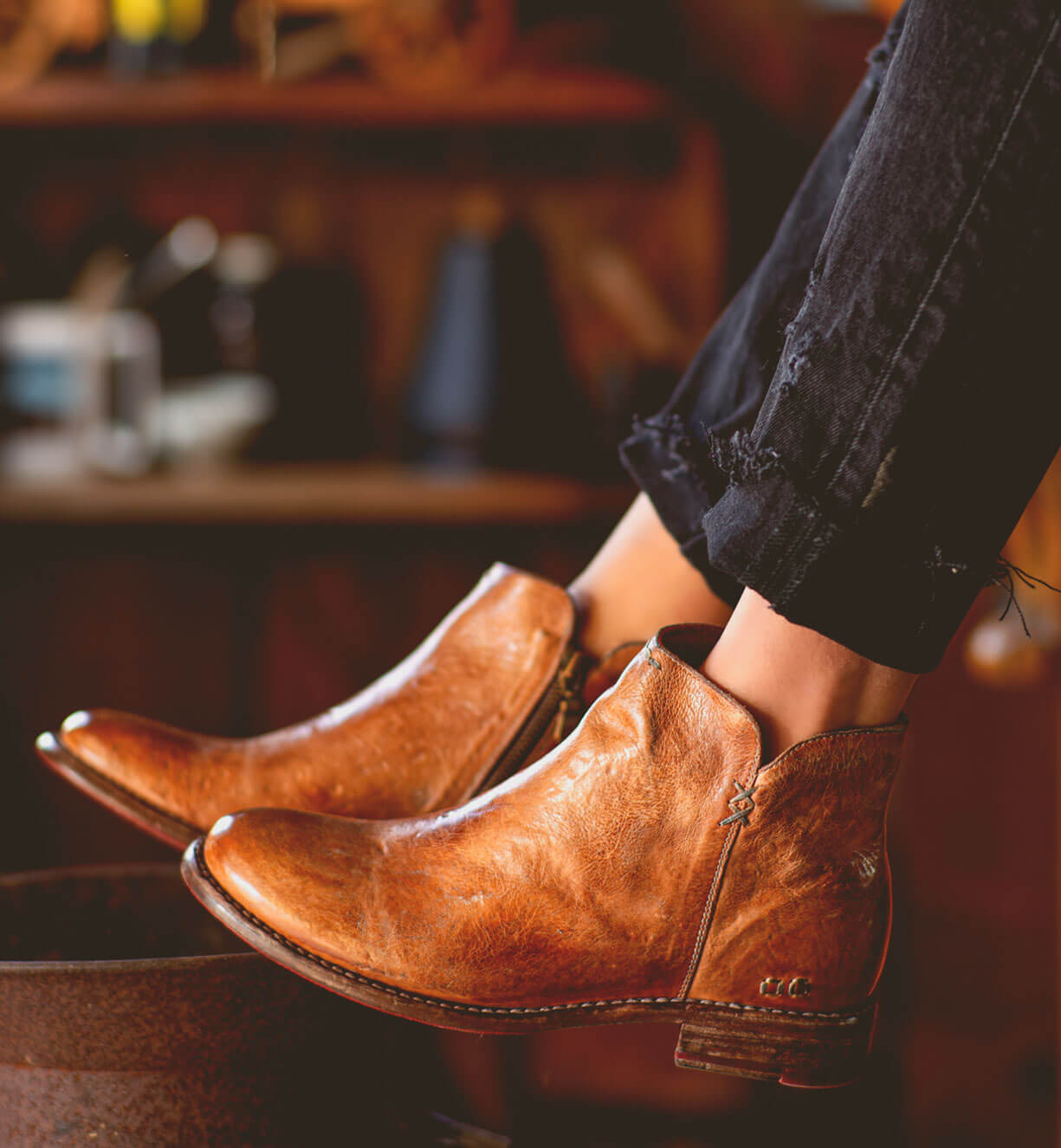 A woman wearing a pair of Yurisa brown leather boots by Bed Stu.