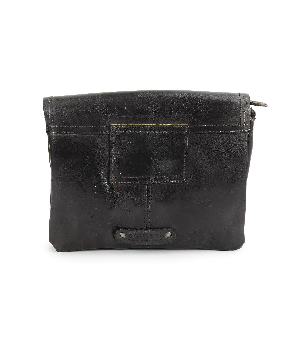 The Ziggy JB by Bed Stu is a black leather crossbody bag featuring a front patch, visible stitching, metal rivets, and a small brand label near the bottom.