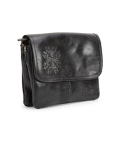 The Ziggy JB by Bed Stu is a small black leather crossbody bag featuring a front flap, minimal stitching, and a subtle embossed design.