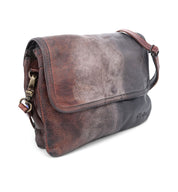 A brown and black leather Ziggy messenger bag with a strap, made by Bed Stu.