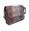 A brown and black leather Ziggy messenger bag with a strap, made by Bed Stu.