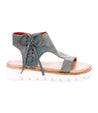 A women's Zoe II blue leather sandal with white soles by Bed Stu.