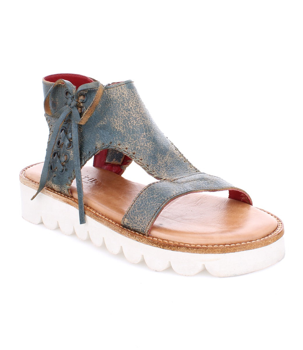 A women's blue leather sandal with white soles, the Zoe II by Bed Stu.