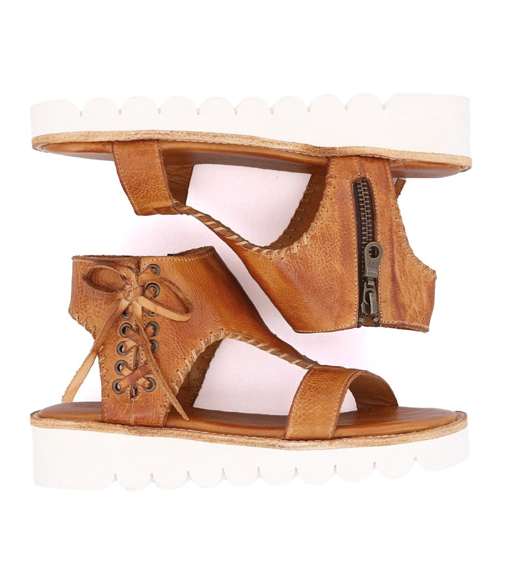 A pair of Zoe II tan leather sandals with zippers by Bed Stu.